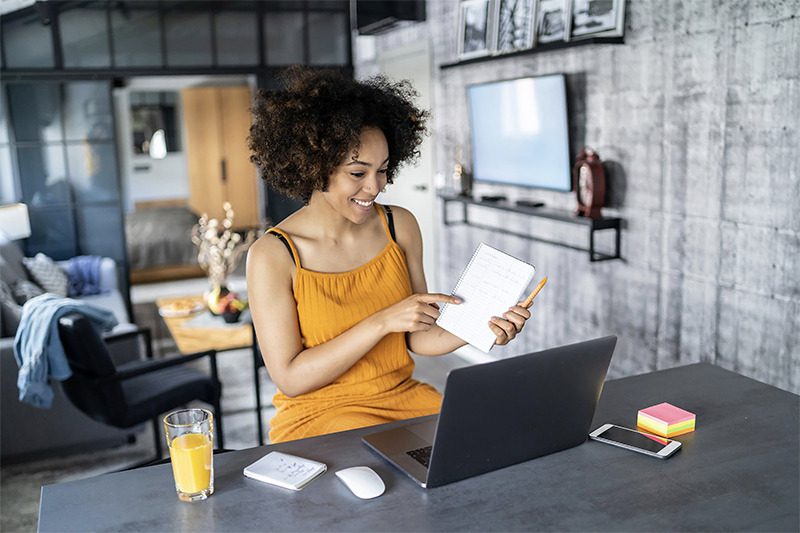 300-dpi-AA-woman-w-laptop conference from home