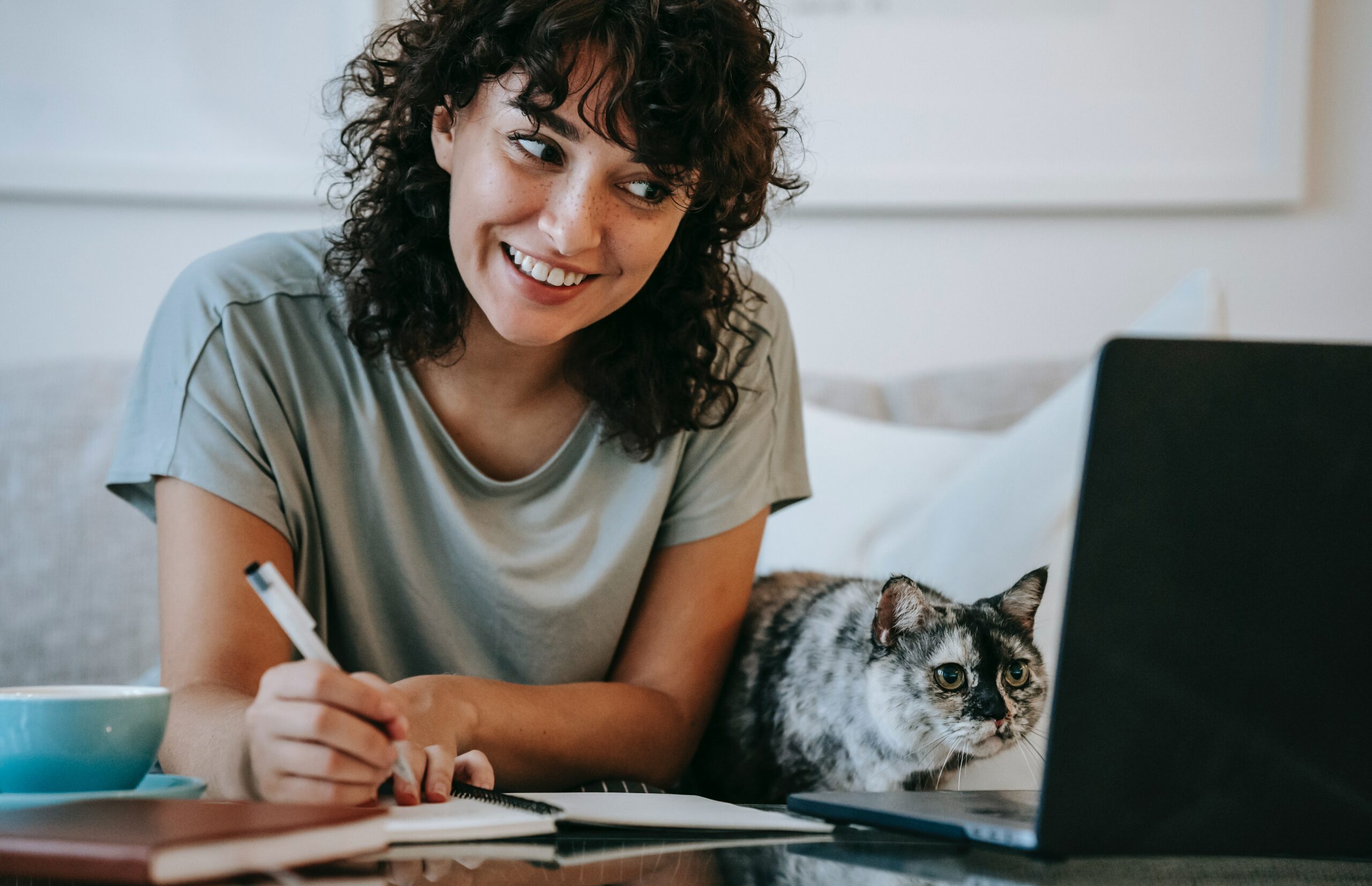 pexels-sam-lion-6002000 woman with cat using computer