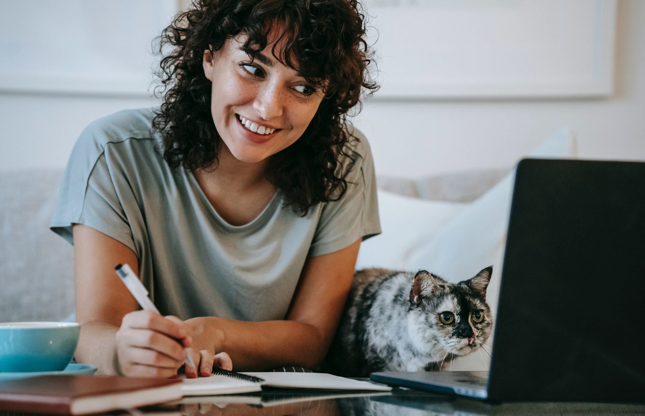 woman with cat using computer