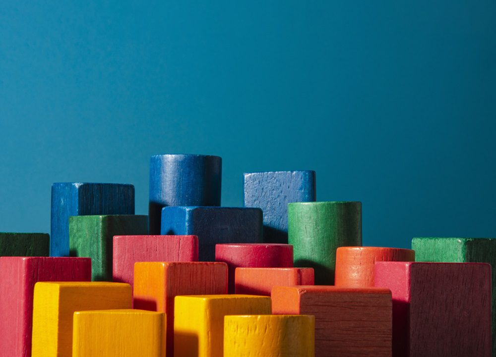 Toy of colored wood blocks. Skyscraper metaphor